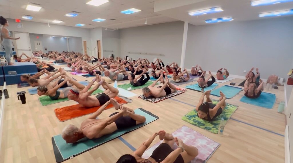 Class in Bow Pose at Hot Yoga Naples
